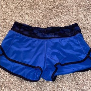 Royal blue and black lululemon workout shorts